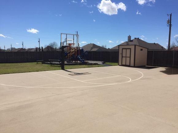 Fenced outdoor playground